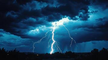 dark night sky with clouds and flashing bright lightning during a thunderstorm photo