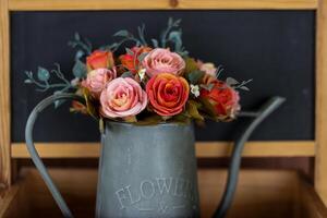 Charming flower arrangement brings joy and vibrant color to this rustic display photo