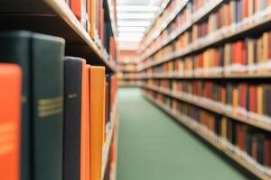 Bookshelves lined with colorful books in a library setting. photo