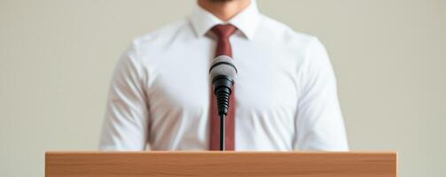 Professional speaker at podium with microphone ready to present. photo