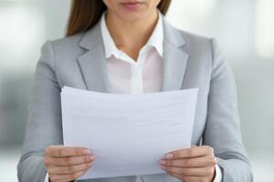 Professional woman reviewing documents in a business setting. photo