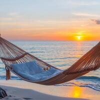 Hammock by the beach at sunset, creating a serene atmosphere. photo