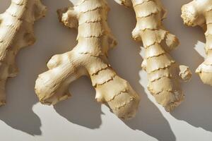 Dried ginger roots arranged on a light background. photo