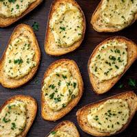 Rustic bread slices topped with creamy herb spread. photo