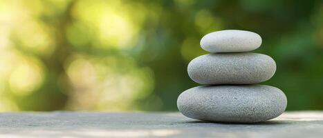 Stacked stones with a soft green background creating a calming atmosphere. photo