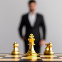 A focused chess piece with a blurred figure in formal attire. photo