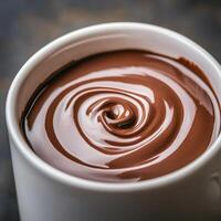 Creamy chocolate swirl in a white cup. photo