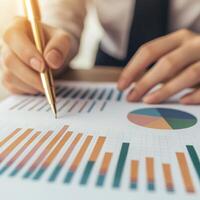 Business professional analyzing graphs and charts on paper. photo