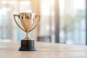 Shiny trophy on a table, symbolizing achievement and success. photo