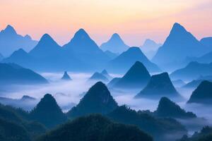 Serene mountain landscape with mist and soft pastel colors at dawn. photo