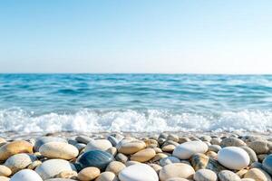 Serene beach with smooth pebbles and gentle waves. photo