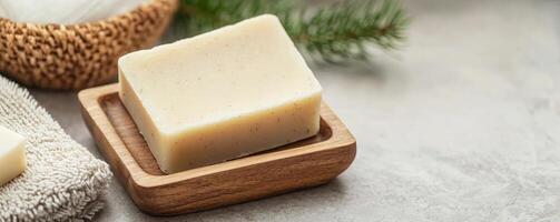 Natural soap on a wooden dish with a cozy, rustic background. photo