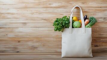 Tote bag filled with fresh vegetables on wooden background. photo