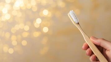 Toothbrush held against a sparkling background. photo