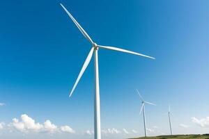 Wind turbines against a clear blue sky. photo