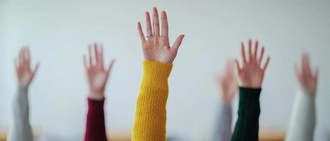 Hands raised in a classroom setting, inviting participation. Communication skills verbal. photo