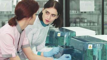 Healthcare scientists engaged in a dynamic discussion at the lab video