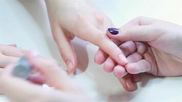 Expert manicure in progress with elegant nail polish application video