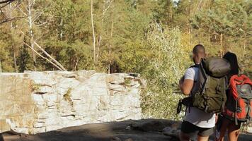 Adventurous couple reaches the cliff's edge video