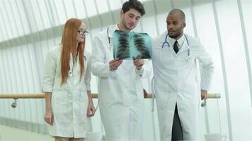 Doctors analyzing lung X-ray to highlight smoking dangers video