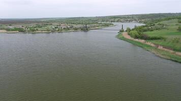 Aerial view of an old bridge over the river. video