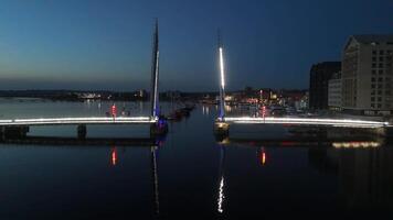 28 April 2025 Poole, Uk. Twin Sails Bridge during the night in Poole, UK video