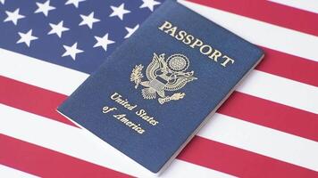 American passport against the background of the US national flag. Document for travelling and business video