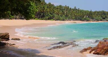 Silent Beach Sri Lanka with strong waves and morning sun under clear sky5 video