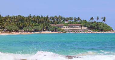 Silent Beach Sri Lanka with strong waves and morning sun under clear sky3 video