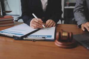 Lawyer and client signing documents at the office photo