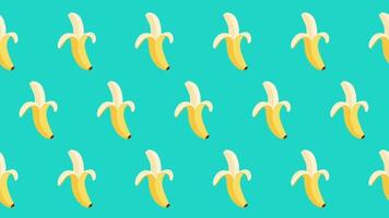 Rows of identical bananas arranged neatly against a teal background create a uniform and structured fruity composition video