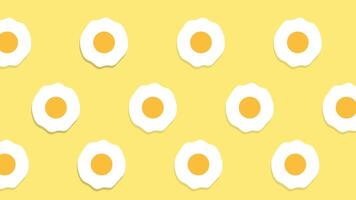 Fried egg shapes form a playful polka-dot pattern on a pale yellow background, giving a fun and quirky design touch video