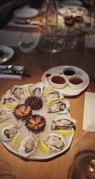 Champagne tasting, Wine glasses are on the table, stylish table setting, sparkling wine bubbles, oysters and sea urchins, special sauce video