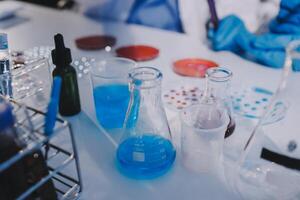 A table with several test tubes and beakers photo