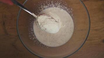 Mixing flour and water in bowl to make dough at home video