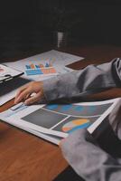 A person is looking at a business report on a table photo