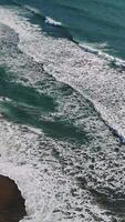 Powerful waves rolling, crashing against sandy coastline, highlighting dynamic marine energy and natural rhythmic movement video