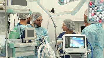 Surgical team engaged in discussion in the operating room video