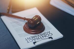 A gavel on a paper with a contract on it photo