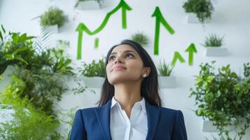 Business growth concept with confident professional amidst greenery and upward arrows. Indian girl standing at home office photo