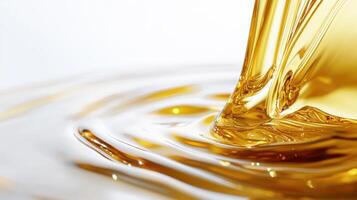 Golden liquid flowing smoothly creating ripples in macro detail. Stream of fuel pouring photo