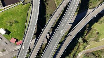 Top-down view of multilane highway intersection and green landscape video
