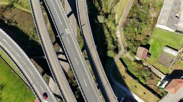 Vertical aerial view of multilane highway and rural settlement video
