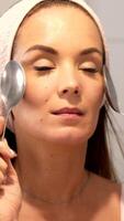 Relaxing vertical facial massage with spoons during skincare routine video