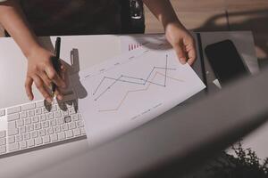 A person is working on a graph on a paper photo