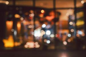 Abstract urban nightlife scene with defocused bokeh lights background photo