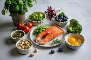 Fresh salmon fillet accompanied by vibrant vegetables and nuts on a light gray background creates a healthy culinary display photo