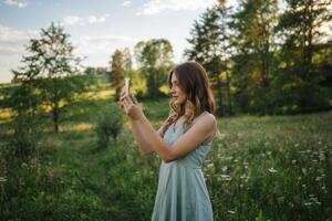 Capturing the beauty of nature in a meadow filled with wildflowers on a sunny day photo