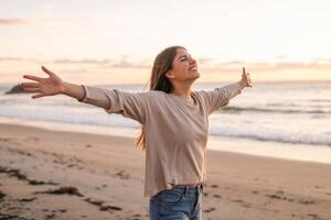 Embracing the serene sea breeze at sunrise along a peaceful beach in California photo