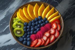 A bowl of fruit with strawberries, blueberries, and kiwi photo